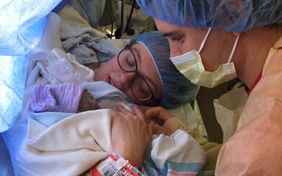 Parents Sierra & Keaton gaze at their newborn son, Zion Jeremiah.