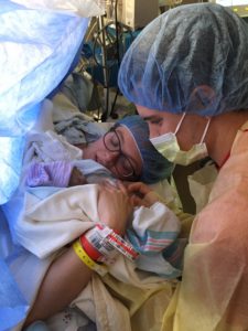 Parents Sierra & Keaton gaze at their newborn son, Zion Jeremiah.