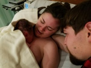 Samantha holds her baby on her chest moments after his birth